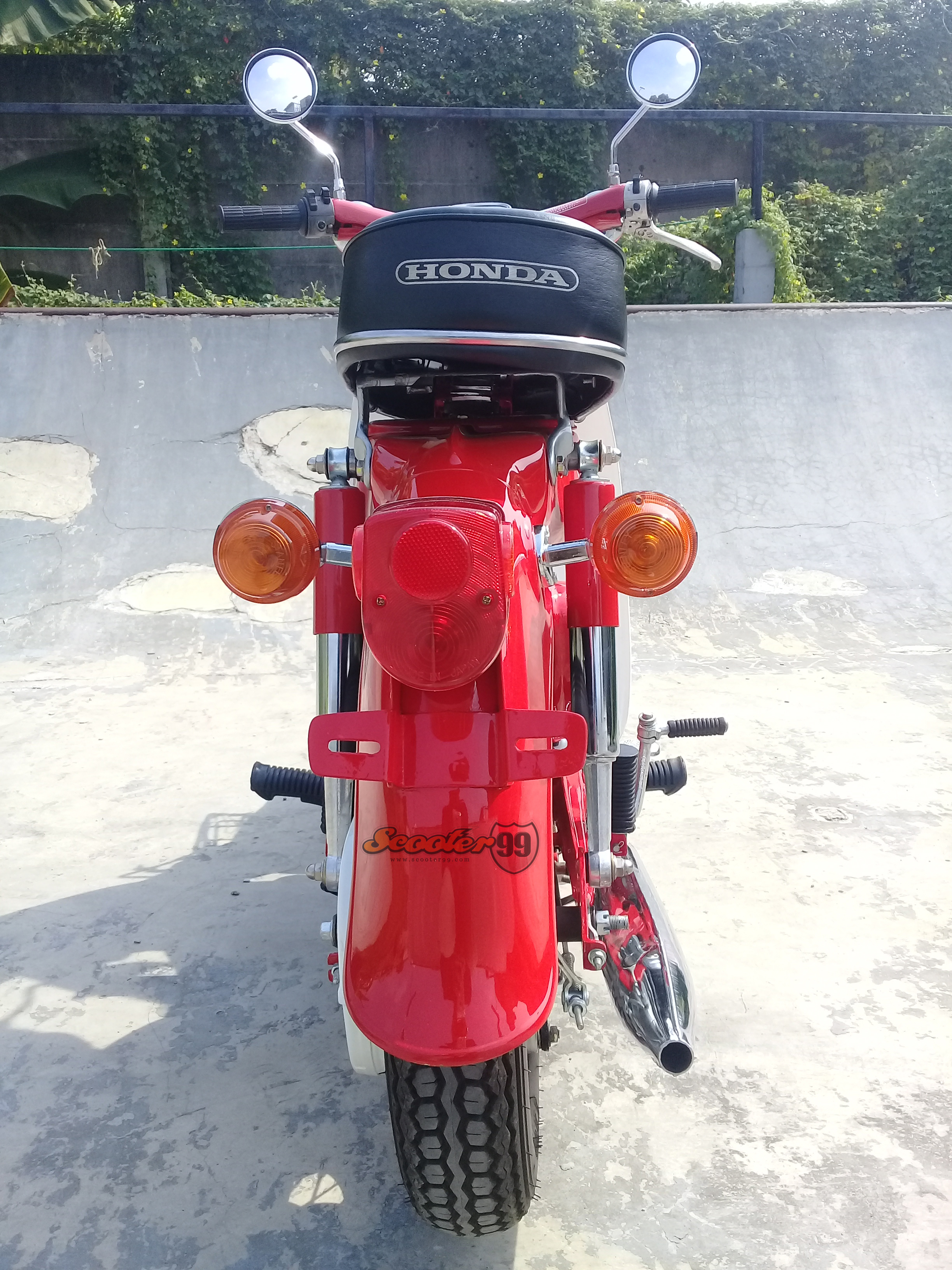 Rear angle Honda C70 Deluxe Mini Bike with chrome exhaust